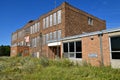 Old abandoned schoolhouse falling into ruins Royalty Free Stock Photo