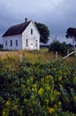 Old abandoned schoolhouse in a rural field