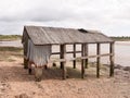 An old and abandoned sea shack shed decaying and rotting Royalty Free Stock Photo