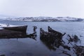 An old abandoned ship on the shore of the Barents Sea in the Arctic Ocean. The village of Teriberka Kola peninsula. The