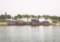 Old and Abandoned Ships in Spetses Island, Greece. Five Boats in a Row in Peaceful Gulf