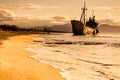 Rusty broken shipwreck on sea shore