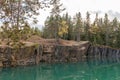 Old abandoned silver mine with blue, emerald water on a sunny evening. silverberg in Sweden. selective focus Royalty Free Stock Photo