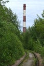 Old abandoned single track railway track to the factory