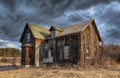 Old abandoned spooky looking house in winter on a farm yard in rural Canada Royalty Free Stock Photo