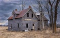 Old abandoned spooky looking farmhouse in winter on a farm yard in rural Canada Royalty Free Stock Photo