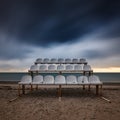 Old abandoned stands on the seashore against the background of the sea and dramatic sky on a long exposure Royalty Free Stock Photo