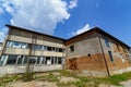 An old abandoned stone building with broken windows. Old warehouse, storehouse, factory. Royalty Free Stock Photo