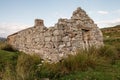 Old abandoned stone house without the roof. Sunset time. Rural Irish farm building. Dramatic sky. Old architecture example. Top Royalty Free Stock Photo