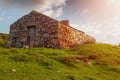 Old abandoned stone house without the roof. Sunset time. Rural Irish farm building. Dramatic sky. Old architecture example. Top Royalty Free Stock Photo