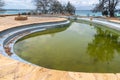 Old abandoned swimming pool, filled with polluted, green rain water. Taken on Prison Island, Zanzibar Tanzania Royalty Free Stock Photo