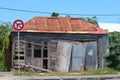 Old abandoned timber house with corrugated tin roof in the Caribbean