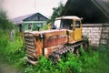 Old abandoned tracked tractor in russia Royalty Free Stock Photo