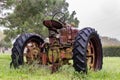 Old abandoned tractor sitting in the rain Royalty Free Stock Photo