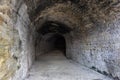 Old abandoned tunnel in the underground wine cellar. Entrance to