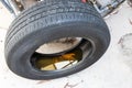 Old abandoned tyre with still water from rain condusive place for aedes mosquito breeding. Selective focus on water.