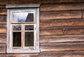 an old abandoned village house rotten logs and a horseshoe