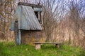 an old abandoned village well in a thicket of bushes Royalty Free Stock Photo