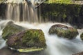 Old, abandoned water mill with water streams and little waterfalls