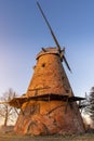 Old abandoned windmills during colourful sunset