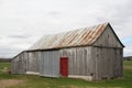 Old abandoned wood barn with red door Royalty Free Stock Photo