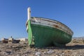 Back view of old abandoned wooden boat on the beach Royalty Free Stock Photo