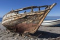 Old abandoned wooden boat on the beach, an old shipwreck boat abandoned stand on beach or Shipwrecked off the coast of Cabo de Royalty Free Stock Photo