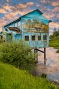 Old Abandoned Wooden Building on the water.