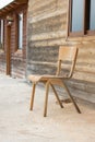 Old abandoned wooden house with chair outside Royalty Free Stock Photo