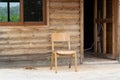 Old abandoned wooden house with chair outside Royalty Free Stock Photo