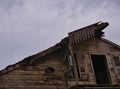 Old abandoned wooden house with missing balcony Royalty Free Stock Photo