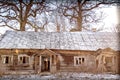 Old abandoned wooden house in winter nature Royalty Free Stock Photo