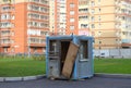 An old abandoned wooden security booth in the area of new buildings