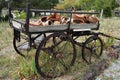 Old and abandoned wooden traditional cart with traditional turkish cooking clay pots