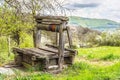 Old abandoned wooden well with beautiful structure on countryside. Royalty Free Stock Photo