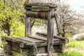 Old abandoned wooden well with beautiful structure on countryside. Royalty Free Stock Photo