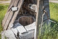 Old abandoned wooden well with beautiful structure in the Siberian village Royalty Free Stock Photo