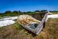 Old abandoned wrecked fishing boat at ship or boat graveyard.