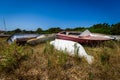 Old abandoned wrecked speed boat at ship or boat graveyard. Royalty Free Stock Photo