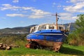 Old abondoned fishing boat on the grass