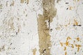 Old abstract wall background. Concrete painted surface with cracks and yellow peeling paint. Royalty Free Stock Photo