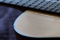 Old acoustic guitar with cracks on the soundboard