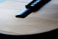 Old acoustic guitar with cracks on the soundboard