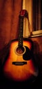 Old Acoustic guitar in a wall Royalty Free Stock Photo
