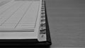 Old address book alphabetical markings closeup shot in grayscale Royalty Free Stock Photo