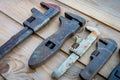 Old adjustable spanners on wooden table ,vintage tools. labour day Royalty Free Stock Photo