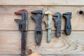 Old adjustable spanners on wooden table ,vintage tools. labour day Royalty Free Stock Photo