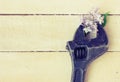 Old adjustable wrench, lilac branch Royalty Free Stock Photo