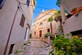 Old adriatic town Vrbnik stone street and church view