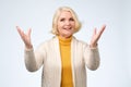 Old adult blonde excited cheerful astonished lady smiling, laughing Royalty Free Stock Photo